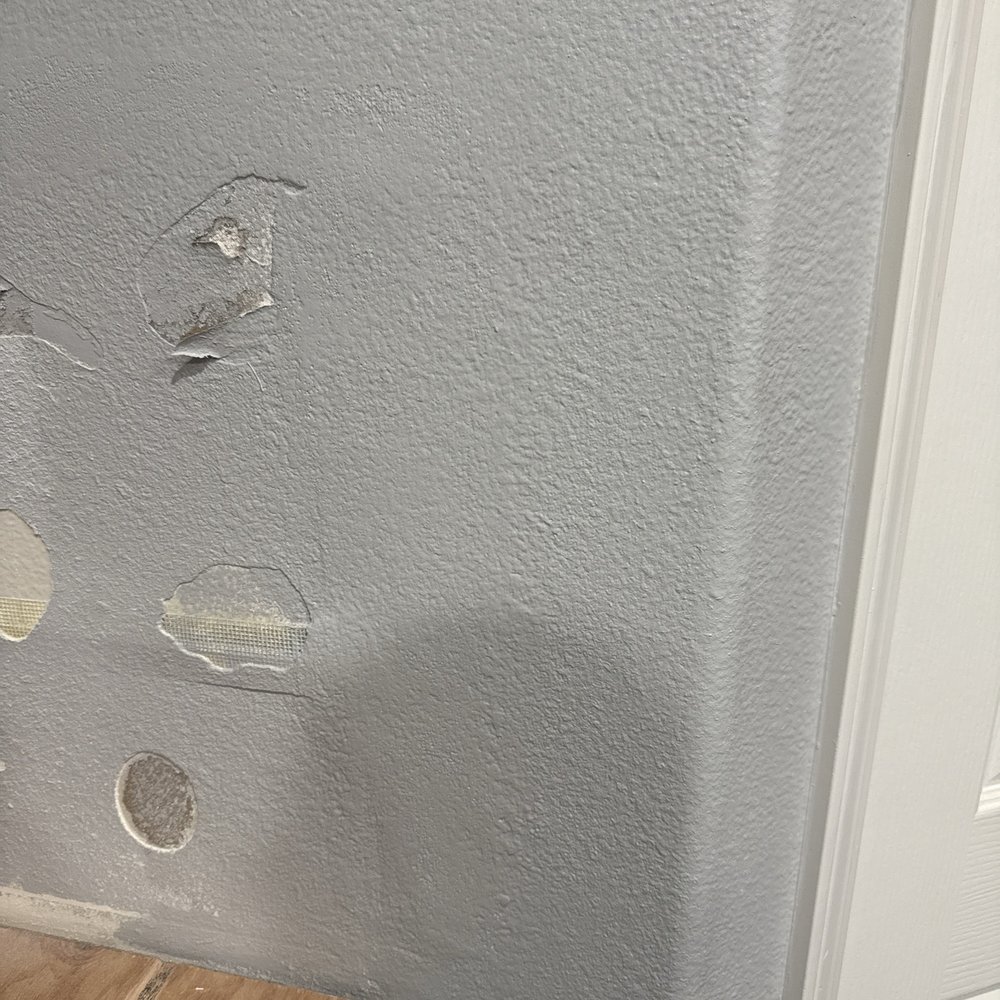 Other side patched and painted. The new slab will cover most of the wall.
