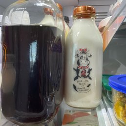 a bottle of milk and a container of yogurt