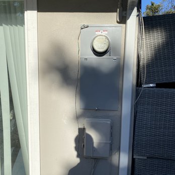 Formosa Electric - Brand new 200A panel.  Roger patched the stucco around the panel and painted to match.  Can't even tell anything was done. - Electricians Near Me - Newark, California
