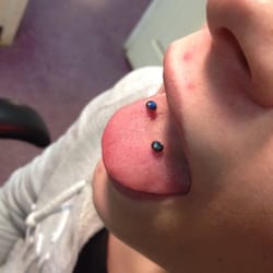Advanced Body Piercing - Snake bite piercings with black opals.