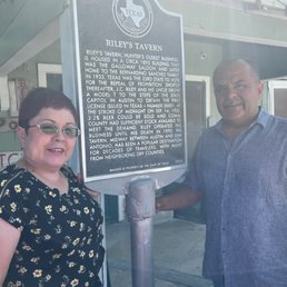 Our cousins, with historical sign.