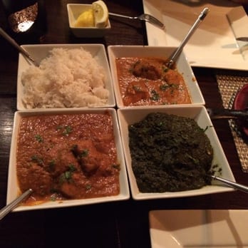 Kama - From top left going clock-wise: plain white basmati rice, Chicken Tikka Masala, Spinach Masala, Lamb Vindaloo. - Indian Near Me - La Grange, Illinois Kama - From top left going clock-wise: plain white basmati rice, Chicken Tikka Masala, Spinach Masala, Lamb Vindaloo. - Indian Near Me - La Grange, Illinois