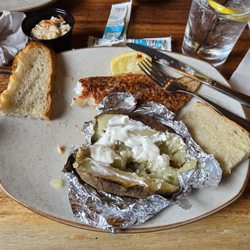 Pine Knot Tavern - This is the haddock filet (broiled) with a baked potato. Cocktail of choice was Titos and soda with lemon whish was also good.