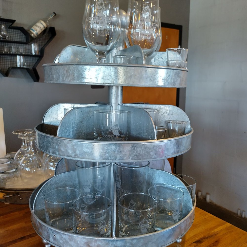 Copper Bottom Craft Distillery - a three tiered display of wine glasses - Distilleries Near Me - Holly Hill, Florida