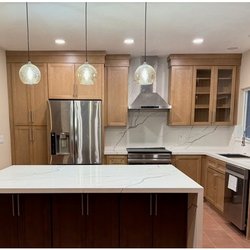 The Tile Outlet - Beautiful Island and backsplash with continuous veining pair so well with double tone cabinets