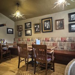 The Rum Runner - Dining area with historic photos and equipment