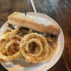 Papa & Nonna’s Pizzeria - Philly Cheesesteak with homemade onion rings.