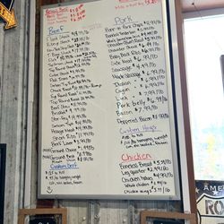 Campbell's Market - Price list in store which shows we would've paid less for our order had we paid for their full retail price