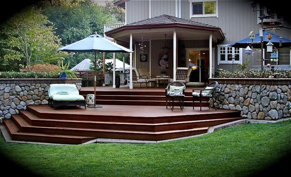 Deck Construction - Deck construction is an engaging and rewarding home improvement project that enhances outdoor living spaces, providing a perfect area for relaxation and entertaining. The process begins with careful planning and design, taking into consideration factors such as the size, location, and intended use of the deck, as well as local building codes and regulations. Materials play a crucial role in the durability and aesthetics of the deck, with popular choices including pressure-treated wood, composite decking, and cedar. Each material offers distinct advantages, such as resistance to weather and pests or low maintenance requirements. Essential steps in deck construction involve laying a solid foundation with concrete footings, building the frame with beams and joists, and then installing the decking boards. Safety features such as railings and stairs should also be incorporated. Proper sealing and maintenance ensure the deck remains a long-lasting addition to the home. Superior Decks is the right choice in creating and building your dream project. Deck Construction - Deck construction is an engaging and rewarding home improvement project that enhances outdoor living spaces, providing a perfect area for relaxation and entertaining. The process begins with careful planning and design, taking into consideration factors such as the size, location, and intended use of the deck, as well as local building codes and regulations. Materials play a crucial role in the durability and aesthetics of the deck, with popular choices including pressure-treated wood, composite decking, and cedar. Each material offers distinct advantages, such as resistance to weather and pests or low maintenance requirements. Essential steps in deck construction involve laying a solid foundation with concrete footings, building the frame with beams and joists, and then installing the decking boards. Safety features such as railings and stairs should also be incorporated. Proper sealing and maintenance ensure the deck remains a long-lasting addition to the home. Superior Decks is the right choice in creating and building your dream project.