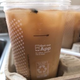 a plastic cup of iced coffee