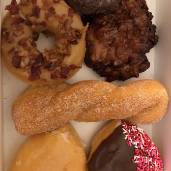 Donut Worry - chocolate glaze, maple bacon, apple cruller, cinna-sugar twist, lemon filled heart, strawberry filled chocolate covered heart. - Donuts Near Me - Lawrenceville, Georgia