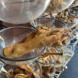 An abundance of dried animal jerky treats from turkey head,  pork feet, I learned today what a beef gullet is