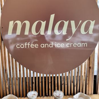 Malaya - Chicken empanada and cheese ensymada with iced caramel banana latte and iced Malaya signature latte - Coffee & Tea Near Me - Arcadia, California Malaya - Chicken empanada and cheese ensymada with iced caramel banana latte and iced Malaya signature latte - Coffee & Tea Near Me - Arcadia, California
