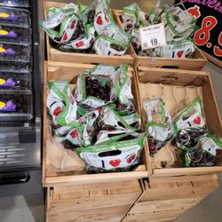 Wegmans - Lady standing putting her bare hand in all cherries eating sins from each