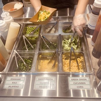 Poke Bar - a variety of salads being prepared - Poke Near Me - Langley Township, British Columbia Poke Bar - a variety of salads being prepared - Poke Near Me - Langley Township, British Columbia