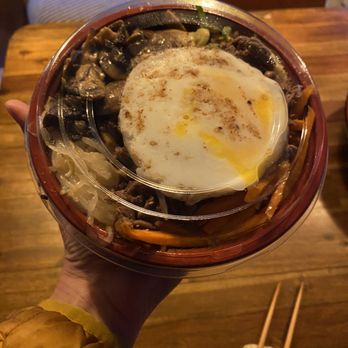 Shodai Teriyaki - a person holding a bowl of food - Chinese Near Me - Seattle, Washington Shodai Teriyaki - a person holding a bowl of food - Chinese Near Me - Seattle, Washington