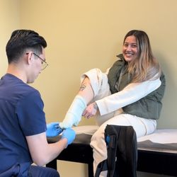 Total Sports Medicine and Orthopedics - Andrew helping me stick my compression sock on