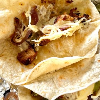 Chipotle Mexican Grill - Three flour taco sans the desired accruements (more chicken please) - Fast Food Near Me - Ashland, Oregon