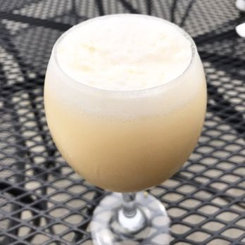 Famous Toastery - Creamsicle Mimosa with cream made in-house - Breakfast & Brunch Near Me - Winston-salem, North Carolina