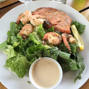 Spuds Waterfront Grill - Dinner salad with wild grilled salmon and prawns - American Near Me - Sandpoint, Idaho Spuds Waterfront Grill - Dinner salad with wild grilled salmon and prawns - American Near Me - Sandpoint, Idaho