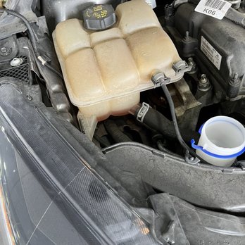 Theodore Robins Ford - That is original coolant reservoir and they hammer and was leaking fluid - Car Dealers Near Me - Costa Mesa, California Theodore Robins Ford - That is original coolant reservoir and they hammer and was leaking fluid - Car Dealers Near Me - Costa Mesa, California