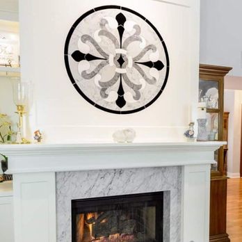 QC Construction - Thinking outside of the box is a great thing! Setting this stone medallion over the mantle really makes a statement. - General Contractors Near Me - Rancho Cucamonga, California QC Construction - Thinking outside of the box is a great thing! Setting this stone medallion over the mantle really makes a statement. - General Contractors Near Me - Rancho Cucamonga, California