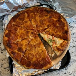a pizza with a slice taken out of it