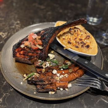 Firebirds Wood Fired Grill - Tomahawk Pork Chop - American Near Me - Grapevine, Texas Firebirds Wood Fired Grill - Tomahawk Pork Chop - American Near Me - Grapevine, Texas