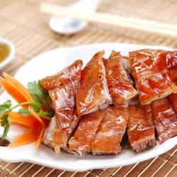 Happy Panda - Roast Duck---The dish is a famous duck dish from Beijing. prized for the thin, crisp skin, with authentic versions of the dish.