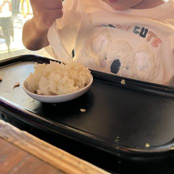 Cagami Ramen - Our little one attacking her rice. - Ramen Near Me - Camarillo, California Cagami Ramen - Our little one attacking her rice. - Ramen Near Me - Camarillo, California