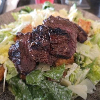 Tavern in the Square - Caesar salad with steak tips added - New American Near Me - Wrentham, Massachusetts Tavern in the Square - Caesar salad with steak tips added - New American Near Me - Wrentham, Massachusetts