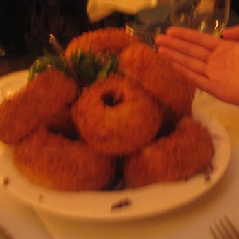 Metropolitan Grill - the onion rings were huge! hand for size comparison. - American Near Me - Seattle, Washington Metropolitan Grill - the onion rings were huge! hand for size comparison. - American Near Me - Seattle, Washington