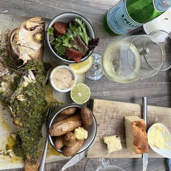 Wild Fish - Whole fish with Chimichurri sauce, fingering potatoes, and a green salad. Pared with a Gewürztraminer - Seafood Near Me - Pacific Grove, California Wild Fish - Whole fish with Chimichurri sauce, fingering potatoes, and a green salad. Pared with a Gewürztraminer - Seafood Near Me - Pacific Grove, California