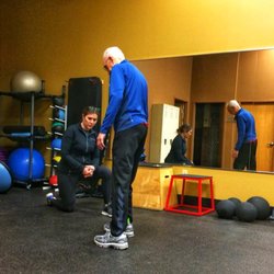 Anytime Fitness - Anna, the morning trainer, working with a member rehabilitating his knee.