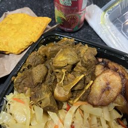 Curry Goat, Beef Patty, Fried Plantains, fSteamed Cabbage. Curry Goat, Beef Patty, Fried Plantains, fSteamed Cabbage.