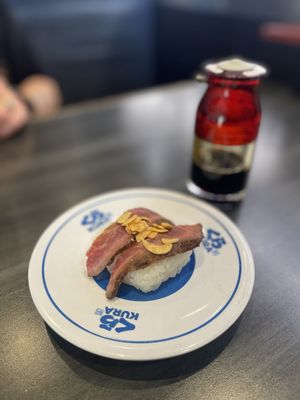 Kura Revolving Sushi Bar by null