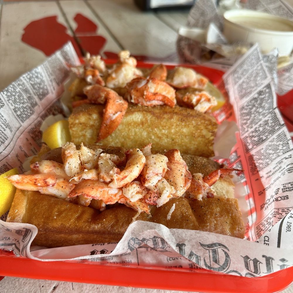 Lobster West - Classic lobster rolls with a bowl of clam chowder in the background - Seafood Near Me - Encinitas, California Lobster West - Classic lobster rolls with a bowl of clam chowder in the background - Seafood Near Me - Encinitas, California
