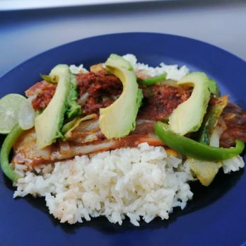 Guisados Adela - Fish over white rice topped with bell peppers and avocado - Mexican Near Me - Tijuana, BCN Guisados Adela - Fish over white rice topped with bell peppers and avocado - Mexican Near Me - Tijuana, BCN