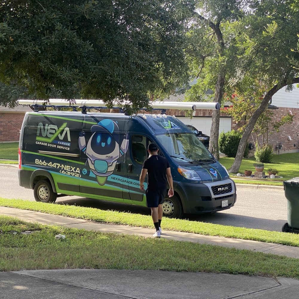 Nexa Garage - The van they rolled up in. Cute mascot. - Garage Door Services Near Me - Pflugerville, Texas