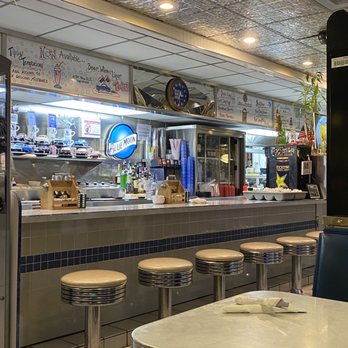 Blue Moon Diner - a view of the counter and seating area - American Near Me - Beaverton, Oregon Blue Moon Diner - a view of the counter and seating area - American Near Me - Beaverton, Oregon