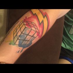 Next Generation Tattoo & Body Piercing - I can do the rubix cube in 37 seconds and had to have flash on the arm. #nerdy geek..