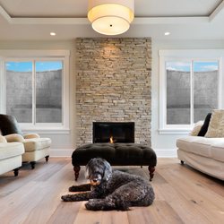 Firescape Egress Windows - Two slider egress windows with grey Rockwell wells.