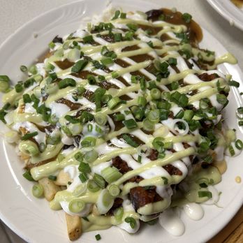 Guud & Evul Vegan Eats - 11. Evul Plate Fries, rice, beans, sauces, 2 different house-made meat. Their version of a garbage plate - New American Near Me - Tonawanda, New York Guud & Evul Vegan Eats - 11. Evul Plate Fries, rice, beans, sauces, 2 different house-made meat. Their version of a garbage plate - New American Near Me - Tonawanda, New York