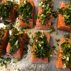 Chef Gloria B - Salmon ready to be roasted with herbs, scallions, turmeric, ginger, olive oil and lemon juice