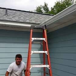 AA Gutter Services - One of the AA Gutter crew doing the corner on my porch.