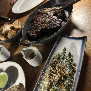 Klaw Miami - 32oz Porterhouse Steak with a side of grilled asparagus - Steakhouses Near Me - Miami, Florida