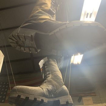 Hilo Surplus Store - Giant boots hanging from the rafters - Outdoor Gear Near Me - Hilo, Hawaii