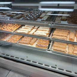 a display case filled with different types of donuts