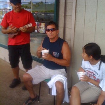 Hawaiian Blizzard - In 2010, Aaron playing the ukulele while we enjoy shave ice - Shaved Ice Near Me - Kapaa, Hawaii