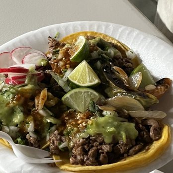 Tacos La Choca - a white paper plate with a taco salad on it - Food Trucks Near Me - San Jose, California Tacos La Choca - a white paper plate with a taco salad on it - Food Trucks Near Me - San Jose, California